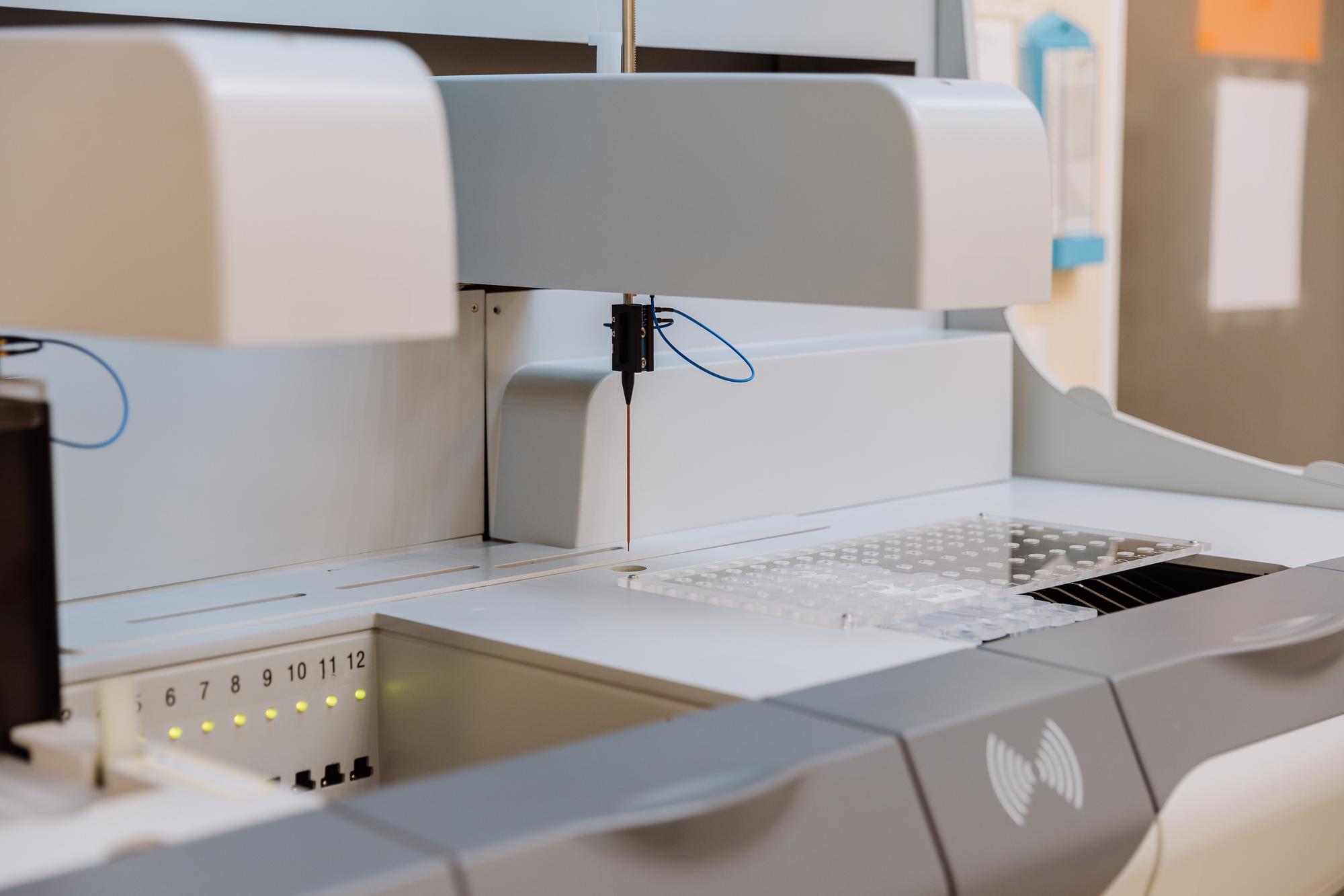 Studio workspace with embroidery machines and samples